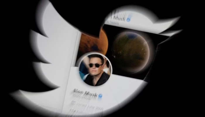 Elon Musk twitter account is seen through Twitter logo in this illustration taken, April 25, 2022. — Reuters