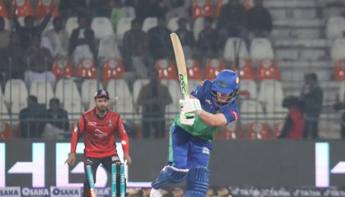 Multan Sultans batter shoots a shot as Lahore Qalanadars wicketkeeper looks in during the first match of the Pakistan Super League (PSL) at the Multan Cricket Stadium in Multan on February 13, 2023. — PSL