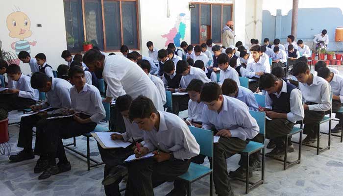Students sit for an exam in Swat. — AFP/File