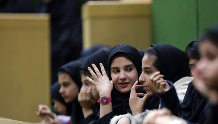A file picture shows Iranian schoolgirls during a field trip to parliament.— AFP