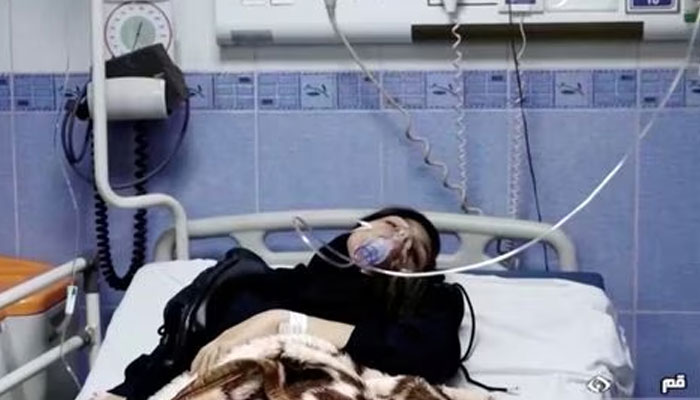 A young woman lies in hospital after reports of poisoning at an unspecified location in Iran in this still image from a video from March 2, 2023.—Reuters