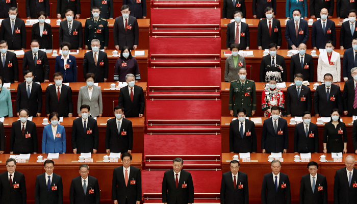 Chinese President Xi Jinping and other officials sing the national anthem at the opening session of the National Peoples Congress at the Great Hall of the People in Beijing, China March 5, 2023. — Reuters