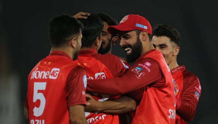 Islamabad United players celebrate during the 21st match of the Pakistan Super League in Pindi Cricket Stadium in Rawalpindi on March 5, 2023. — PSL
