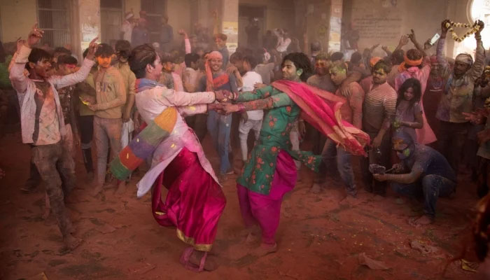 People enjoying the festival of colours. Photo: AFP/File