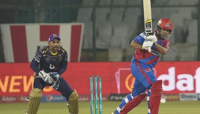Quetta Gladiators wicketkeeper looks on as Karachi Kings batter shoots a shot during a match of PSL 2023. — PSL