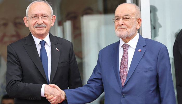 Chairman of Turkey’s main opposition Republican People’s Party (CHP) Kemal Kilicdaroglu (left) and Chairman of the Felicity Party (SP) Temel Karamollaoglu pose for the press ahead of a meeting between opposition party leaders in Ankara on March 6, 2023. — AFP