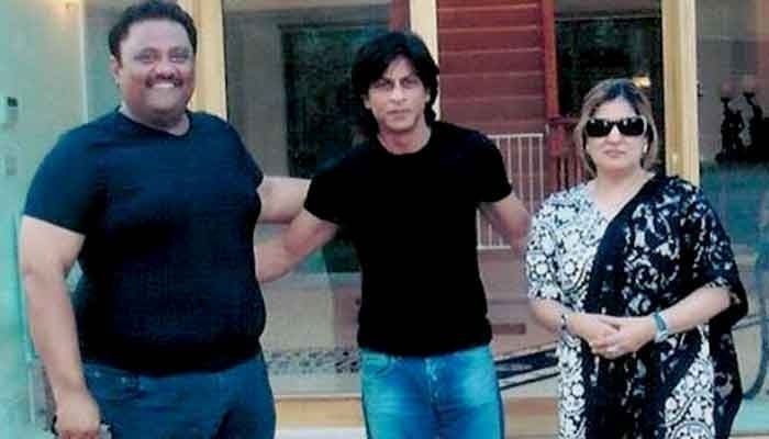 (Left to right) Asif Hafeez, Shahrukh Khan, and Asif Hafeezs wife. — News agencies
