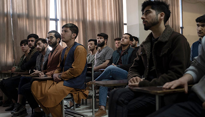 Male students attend their computer science classes after the universities were reopened in Kabul on March 6, 2023.— AFP