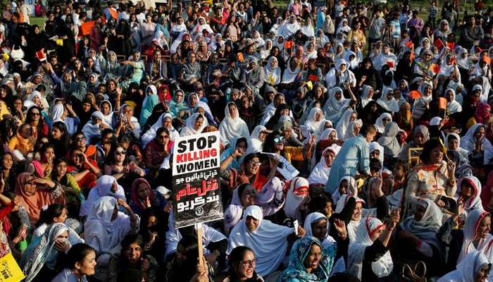 People hold signs and chant slogans as they take part in an Aurat March, or Womens March in Karachi, Pakistan. — Reuters/File