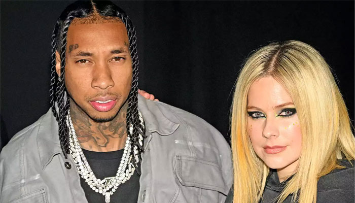Avril Lavigne and Tyga confirm romance with PDA moment at Paris Fashion Week