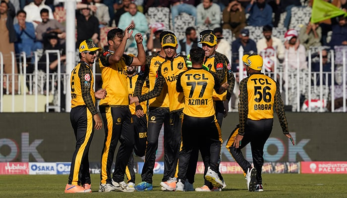 Peshawar Zalmi players celebrate after taking a wicket of Lahore Qalandars during a match at the Pindi Cricket Stadium on March 7, 2023. — PSL