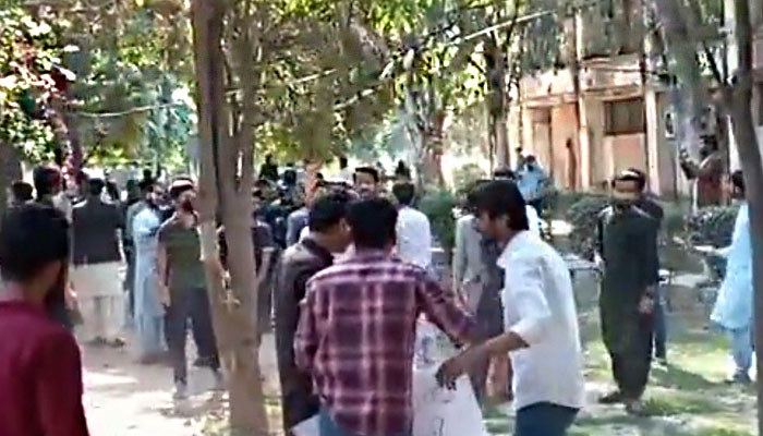 Students clash at the Punjab University. — Twitter/Screengrab/@AsyouNotWish