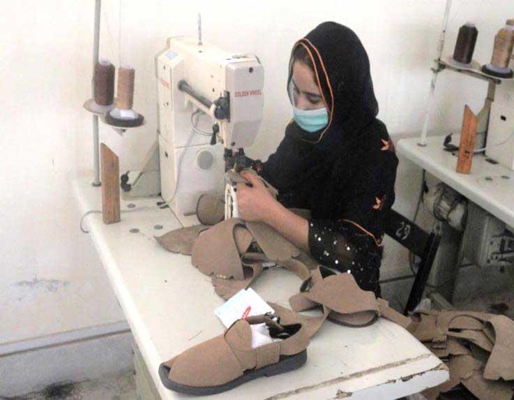 A student at Rukhsaana Vocational Centre, learns shoe making. — Photo by Zoha Tunio