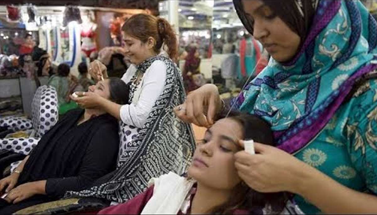 Students practice skills on subjects during personal grooming class at the Memon Foundation. — Photo by Zoha Tunio
