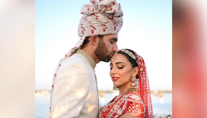 Pakistani actor Ushna Shah poses with her husband, Hamza Amin, during her wedding ceremony held on February 26, 2023. — Instagram/ushnashah