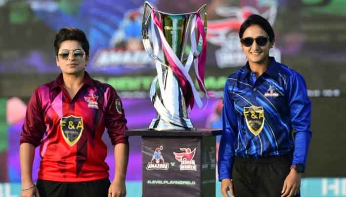 Super Women captain Nida Dar (left) and Amazons captain Bismah Maroof pose with the trophy for the Womens League exhibition matches. — PCB