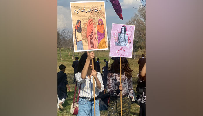 Women holding banners in a rally held in Islamabad on March 7 ahead of the Aurat March. Twitter/AuratAzadiMarch