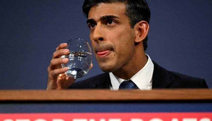 British Prime Minister Rishi Sunak drinks water during a press conference following the launch of new legislation on migrant channel crossings at Downing Street on March 7, 2023 in London, United Kingdom.— Reuters