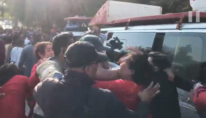 A clash takes place between people during the Aurat March in Islamabad, on March 8, 2023, in this still taken from a video. — GeoNews