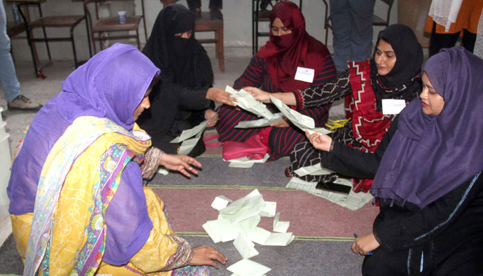 Female election staff counting votes in this undated photo. — APP/File