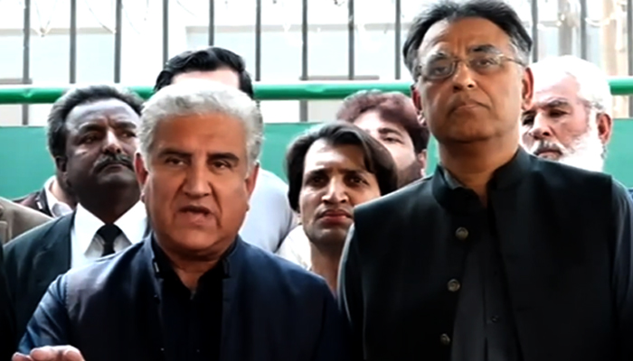 PTI Vice Chairman Shah Mahmood Qureshi (left) addresses a press conference alongside party Secretary General Asad Umar in Islamabad, on March 9, 2023, in this still taken from a video. — YouTube/GeoNews