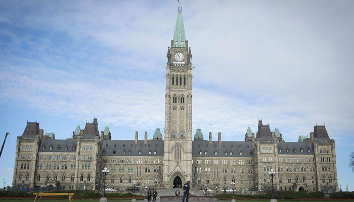 The Canadian Parliament is seen on October 23, 2014, in Ottawa, the day after multiple shootings in the capital city and Parliament buildings left a soldier dead and others wounded. AFP/File