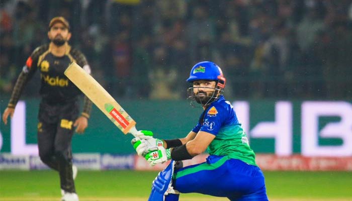 Multan Sultan Captain Mohammad Rizwan hits a shot as a Peshawar Zalmi wicketkeeper looks on during the fifth match of the eighth edition of the Pakistan Super League (PSL) on February 17, 2023. — PSL