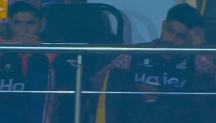 Babar can be seen in the dugout as he could not field during Peshawar Zalmis match against Multan Sultans in Rawalpindi, on March 10, 2023, in this still taken from a video. — Screenshot