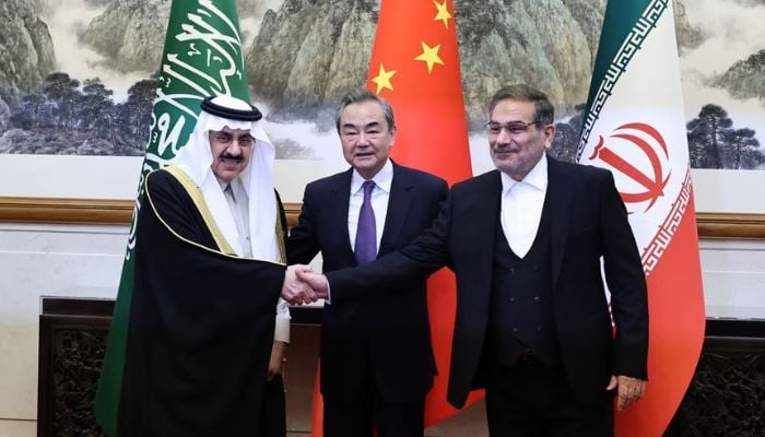 Wang Yi, a member of the Political Bureau of the Communist Party of China (CPC) Central Committee and director of the Office of the Central Foreign Affairs Commission, Ali Shamkhani, the secretary of Iran’s Supreme National Security Council, and Minister of State and national security adviser of Saudi Arabia Musaad bin Mohammed Al Aiban pose for pictures during a meeting in Beijing, China March 10, 2023.— Reuters