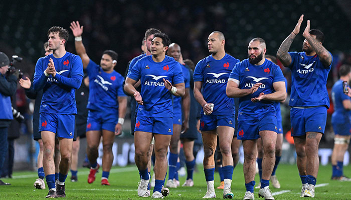 Frances players celebrate on the pitch after the Six Nations international rugby union match between England and France at Twickenham Stadium, south-west London, on March 11, 2023. AFP