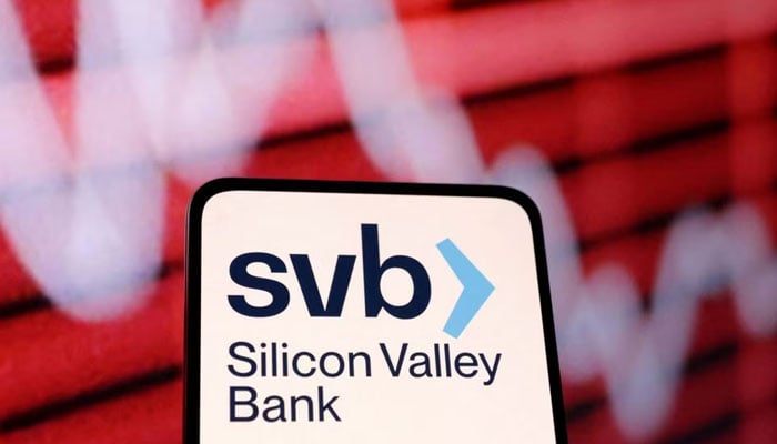 SVB (Silicon Valley Bank) logo and decreasing stock graph are seen in this illustration taken March 10, 2023. REUTERS/File