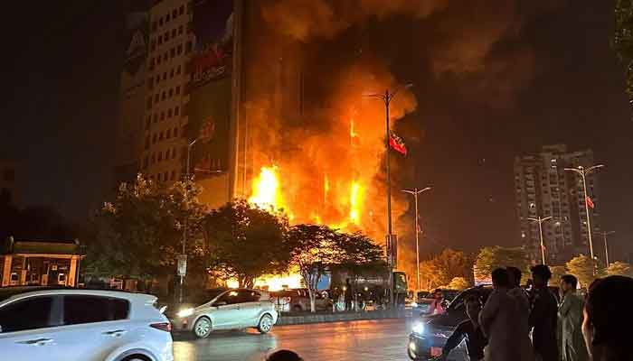 Fire can be seen engulfing the high-rise building in Karachi on March 12, 2023. — Provided by author