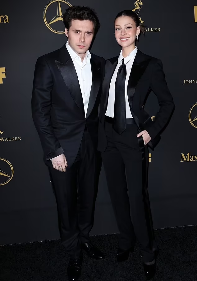 Brooklyn Beckham, Nicola Peltz attend Women in Film Oscar party in classic black suits