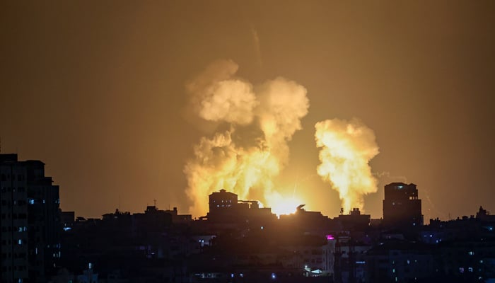 Smoke and fire rise following Israeli airstrikes in Khan Yunis late on August 5, 2022. — AFP