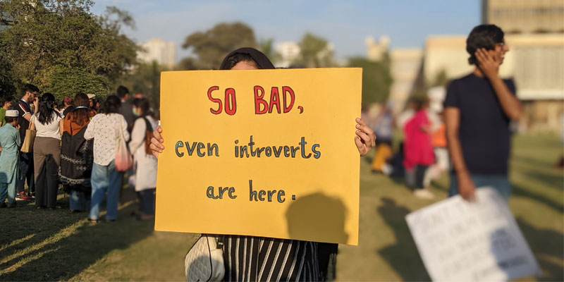 A girl can be seen holding a placard during the Aurat March held at Burns Garden, Karachi on March 12, 2023. — Photo by author