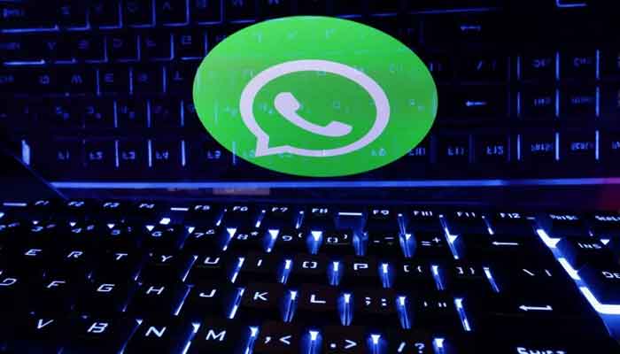 A keyboard is placed in front of a displayed WhatsApp logo in this illustration taken February 21, 2023. — Reuters