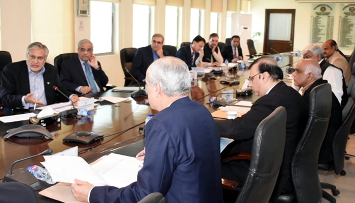Officers directed to 'cease' utilizing autos above 1,800cc 2 Finance Minister Ishaq Dar chairs a meeting of the monitoring committee in Islamabad on March 13, 2023. — PID