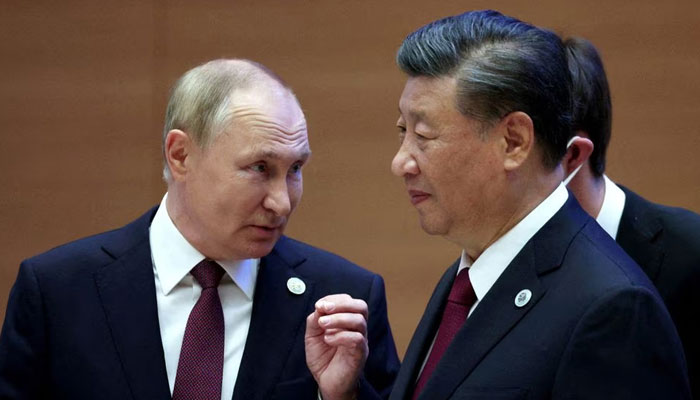 Russian President Vladimir Putin speaks with Chinese President Xi Jinping before an extended-format meeting of heads of the Shanghai Cooperation Organization summit (SCO) member states in Samarkand, Uzbekistan September 16, 2022. — Reuters