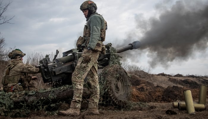 Ukrainian service members fire a howitzer M119 at a front line, amid Russias attack on Ukraine, near the city of Bakhmut. — Reuters/File