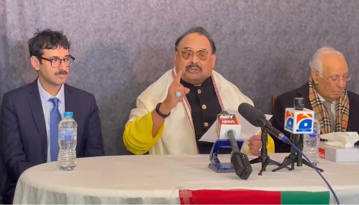 Altaf Hussain (centre) addresses a press conference after the judgement in the London properties case with his lawyer. — Photo by author