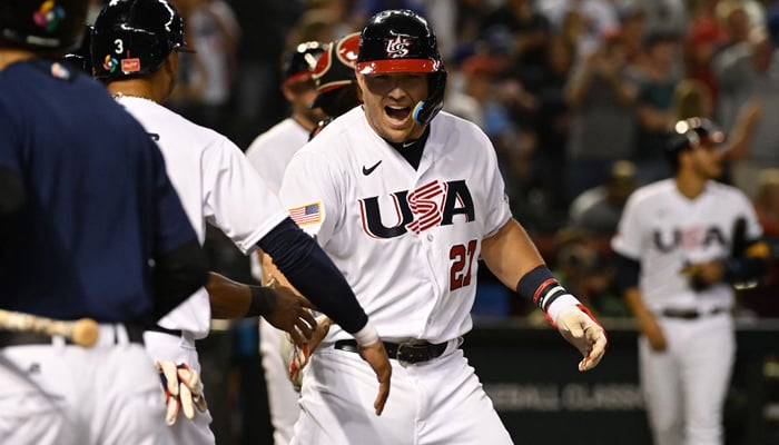 Mike Trout #27 of the United States celebrates with teammates after hitting a three-run home run against Canada in the first inning of a World Baseball Classic Pool C game at Chase Field on March 13, 2023 in Phoenix, Arizona. — AFP