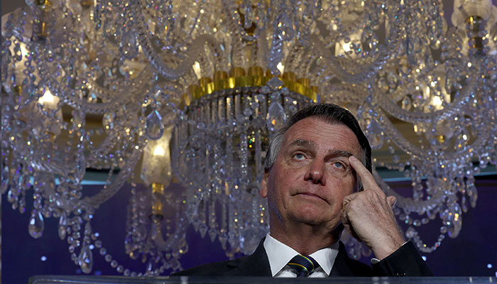 (FILES) In this file photo taken on February 3, 2023, far-right former Brazilian President Jair Bolsonaro speaks during the Turning Point USA event at the Trump National Doral Miami resort in Doral, Florida. Lawyers for Jair Bolsonaro say the former Brazilian president has agreed to hand over to authorities jewels gifted by Saudi Arabia and which entered the country without being declared to tax authorities, local media reported on March 13, 2023.—AFP