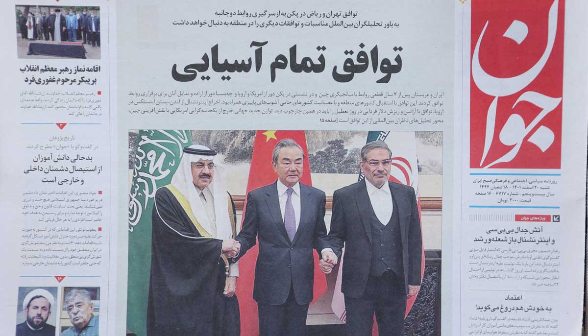 A newspaper with a cover picture of the Iranian Rear Admiral Ali Shamkhani, the secretary of the Supreme National Security Council and Saudi Minister of State and National Security Adviser Musaed bin Mohammed Al-Aiban, is seen in Tehran, Iran March 11, 2023. — Reuters