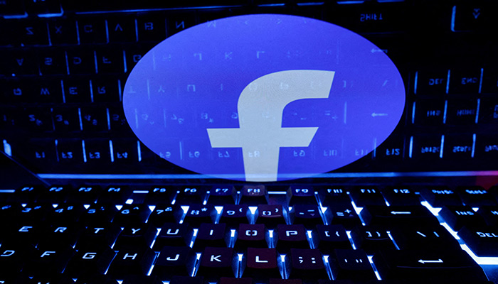 A keyboard is placed in front of a displayed Facebook logo in this illustration taken, on February 21, 2023. — Reuters