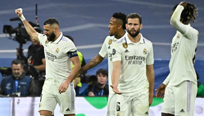 Real Madrids French forward Karim Benzema celebrates scoring a goal during the UEFA Champions League last 16-second leg football match between Real Madrid CF and Liverpool FC at the Santiago Bernabeu stadium in Madrid on March 15, 2023. — AFP