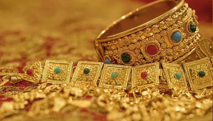 Gold ornaments on display in a jewellers shop. — AFP