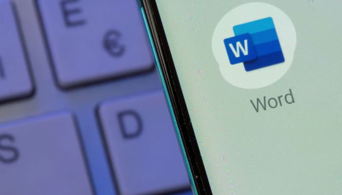 Microsoft Word app is seen on the smartphone placed on the keyboard in this illustration taken, on July 26, 2021. —Reuters