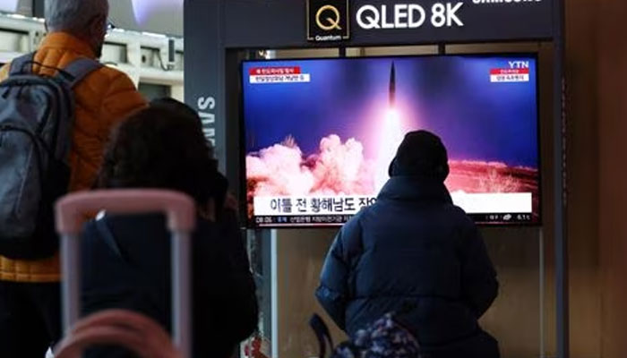 People watch a TV broadcasting a news report on North Korea firing a ballistic missile into the sea off its east coast, at a railway station in Seoul, South Korea, March 16, 2023. —Reuters