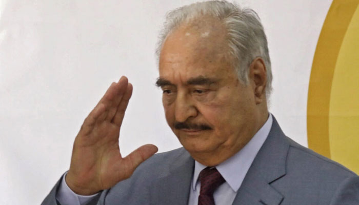 Libyas eastern military chief Khalifa Haftar waves after a speech at the local headquarters of the High National Election Commission in the eastern city of Benghazi on November 16, 2021. AFP/File