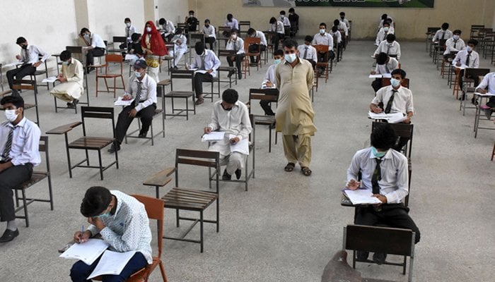 Students during an exam in an examination hall. — Online/File